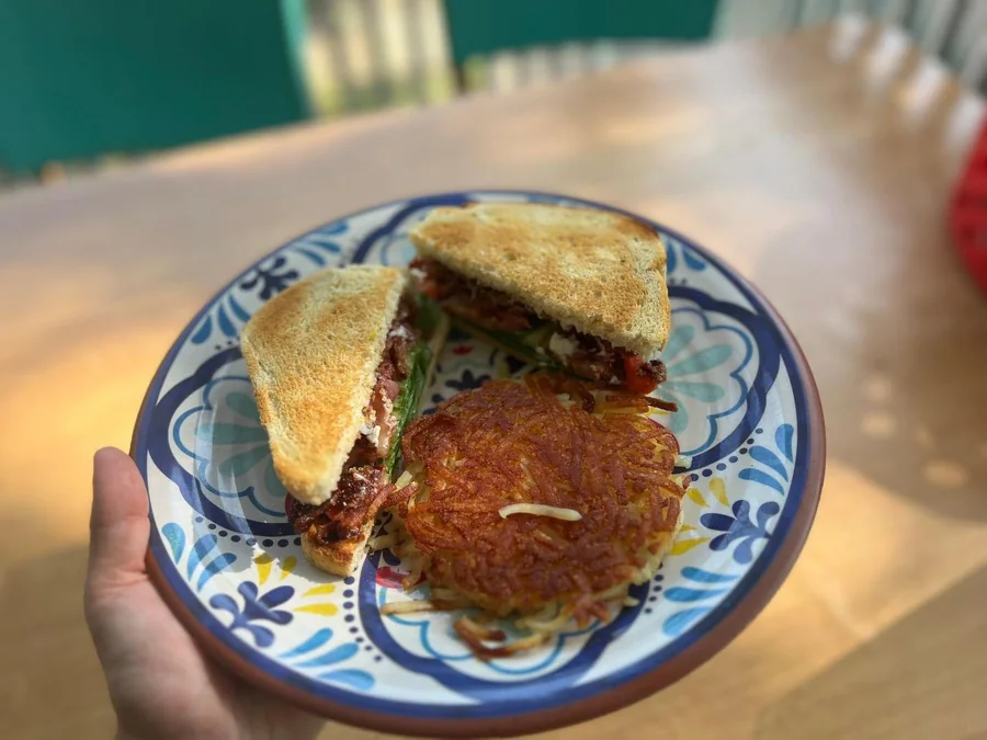 Toasted BLT with a crispy hash brown patty