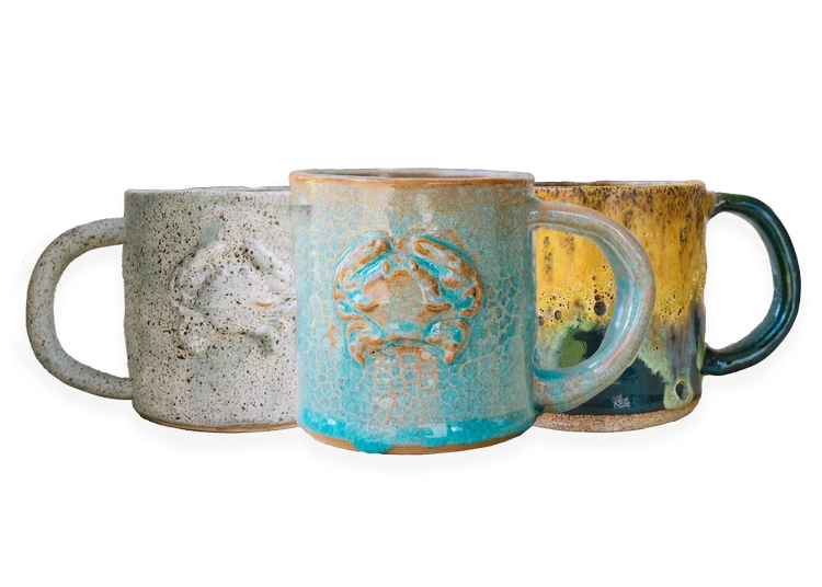 Handmade stoneware coffee mugs in blue and gray glazes
